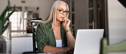 Woman looking at laptop