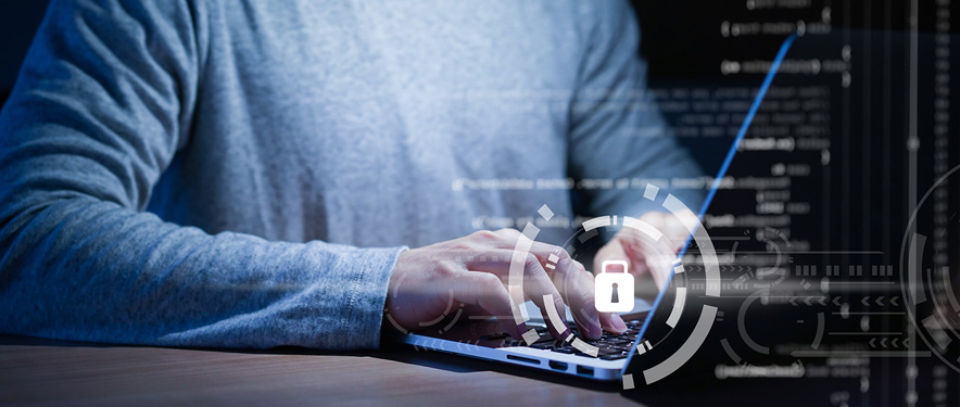 Man on laptop with a lock symbol overlaid