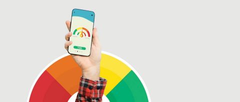A hand holding a phone that shows a credit score range with 735 displayed and a similar credit score range in the background.