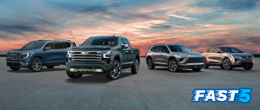 GMC Acadia, Chevrolet Silverado, Buick Enclave and Cadillac OPTIQ at sunset.