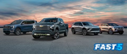 GMC Acadia, Chevrolet Silverado, Buick Enclave and Cadillac OPTIQ at sunset.
