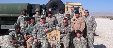 Tod Willoughby (seated front, center) with his artillery platoon in Afghanistan.