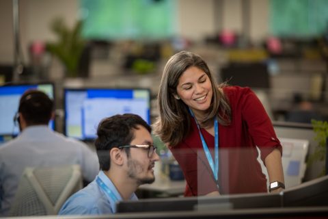 GM Financial team members meeting in the IT Department