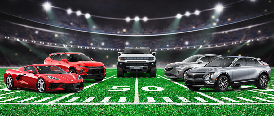 GM vehicles lined up on football field