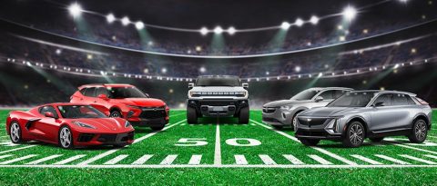 GM vehicles lined up on football field