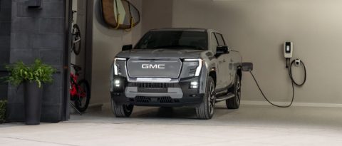 GMC Sierra EV Denali charging at home.