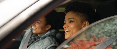 Driver confidently driving their new GM vehicle.