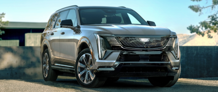 Chevrolet suv driving down a street during a test drive